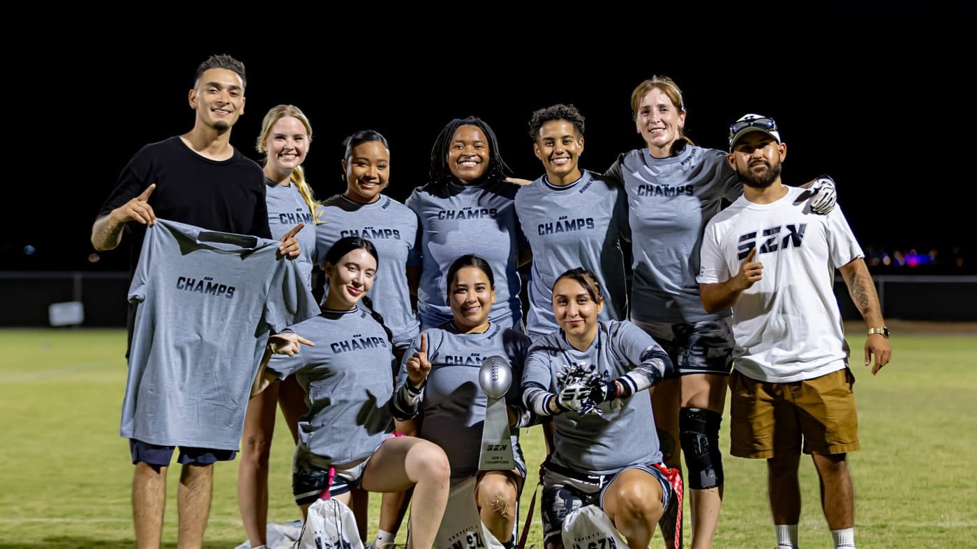 IN SZN players and staff gathered with shirts and awards at night