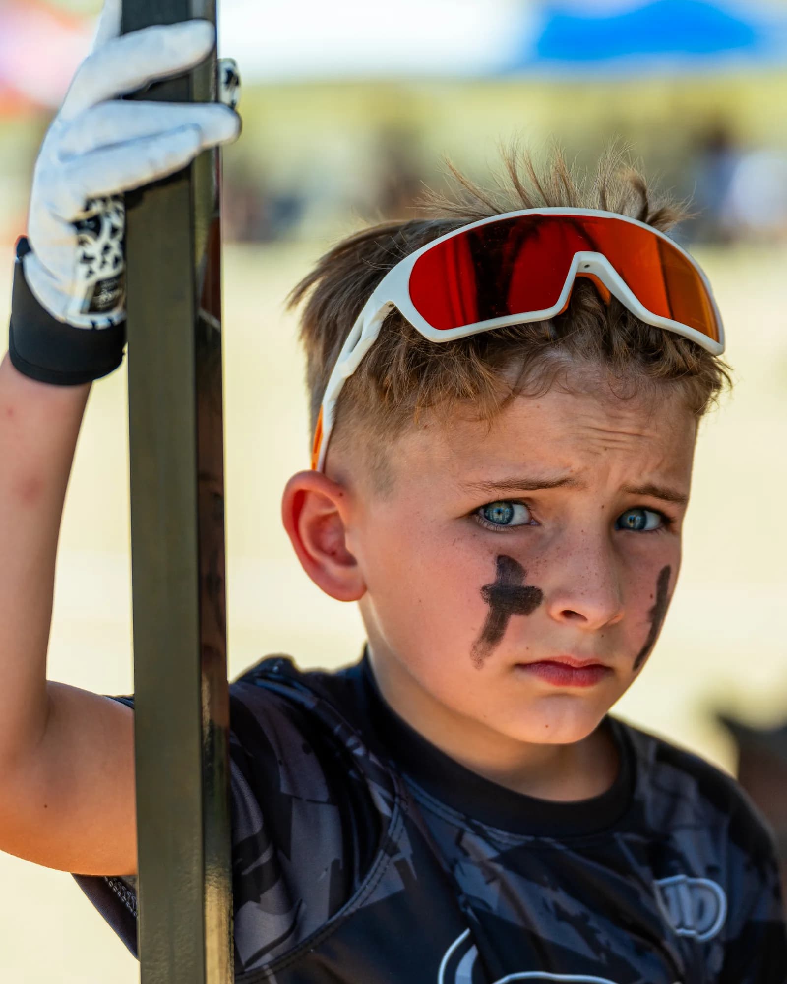 Young flag football player looking toward the camera in game gear